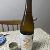 向秀　純米生酒のラベルと瓶 1